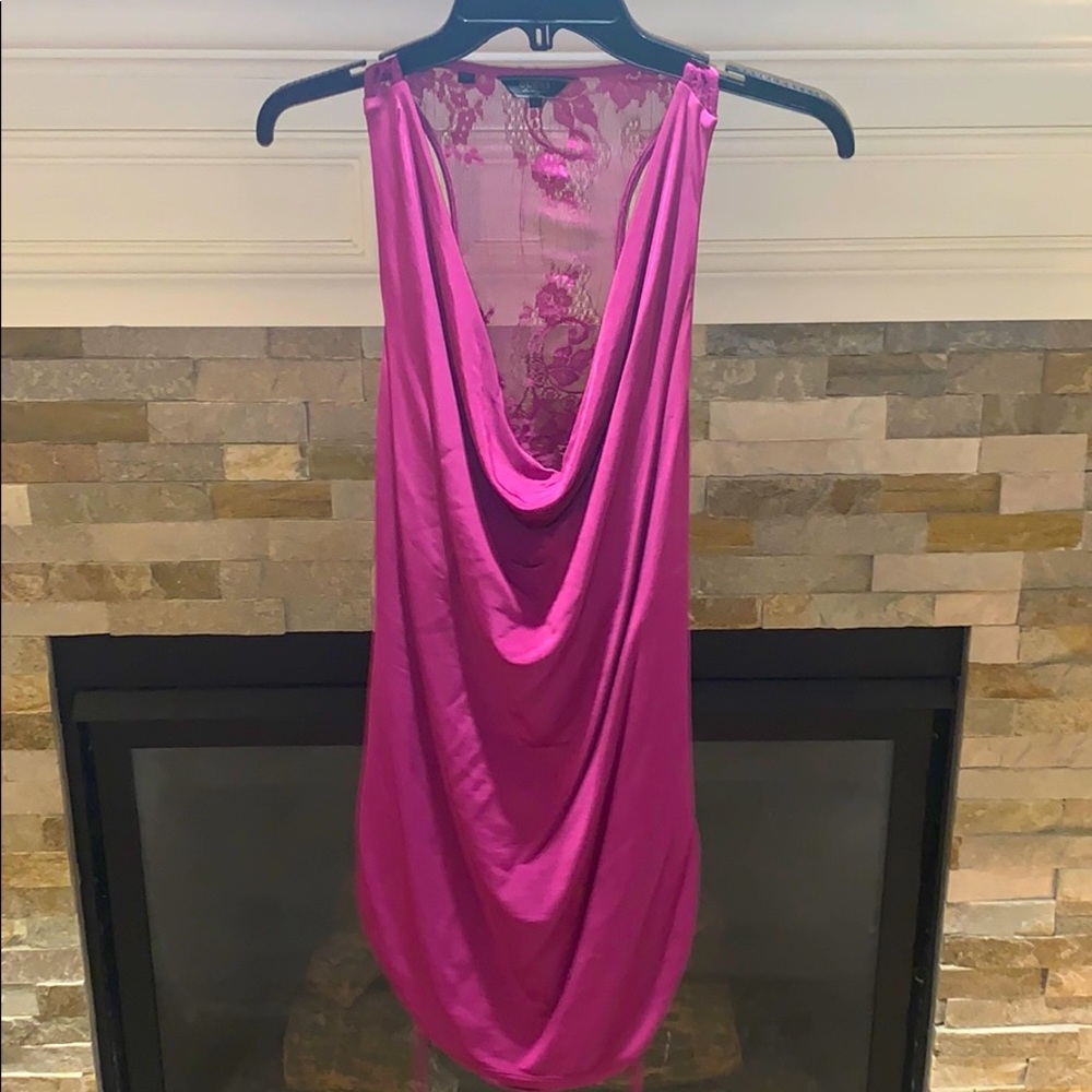 Silky feel razorback tank with a peekaboo back.